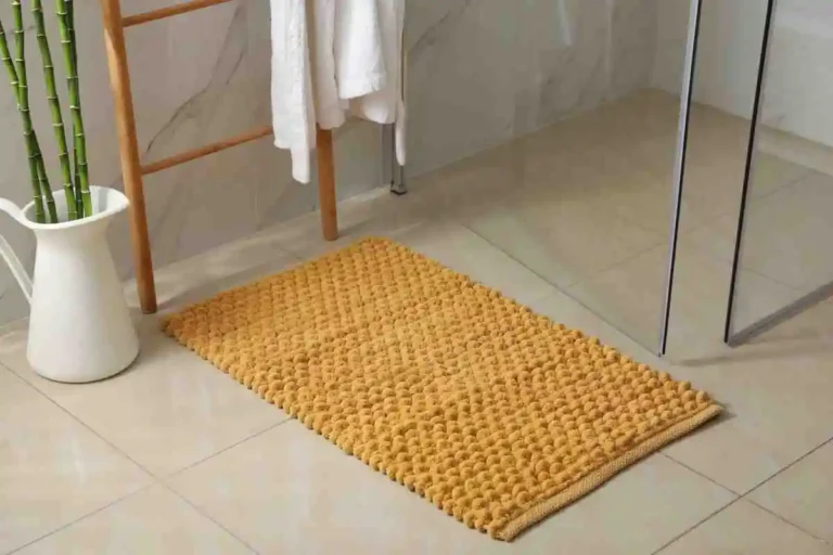bath rug in fron of bathrrom door but will soon go inside the dryer