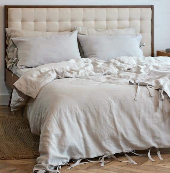 A textured blanket layed on a bed