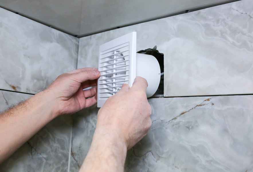 Installing the wall mounted bathroom exhaust fan vent