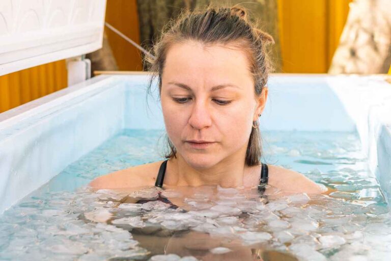 Woman taking cold baths inside an ice water