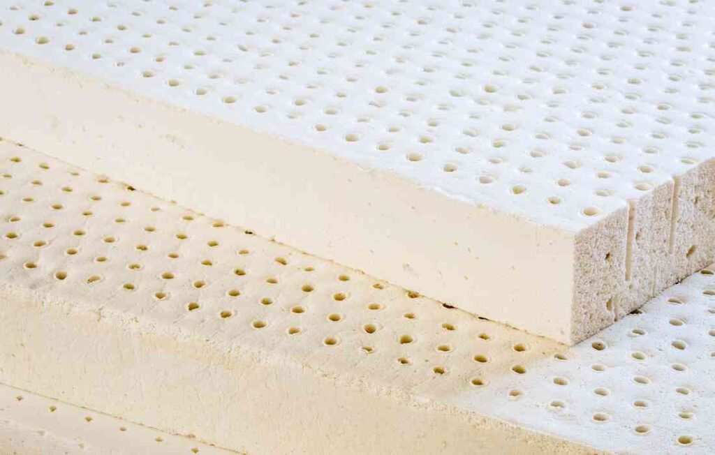 An all natural latex mattress stacked against one another