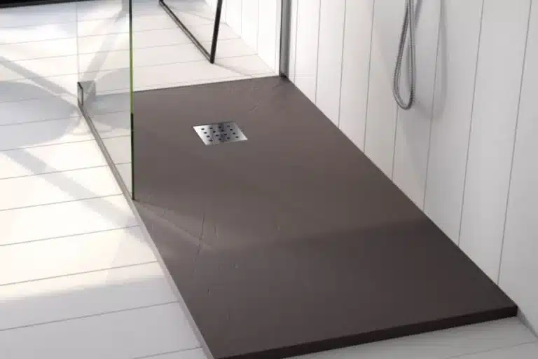 A solid surface shower pan base resin in a modern bathroom