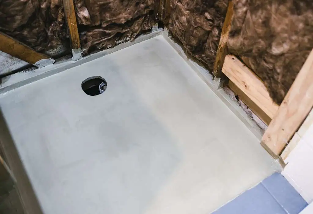 shower renovation with shower walls interior exposed and waterproofing on the shower base floor