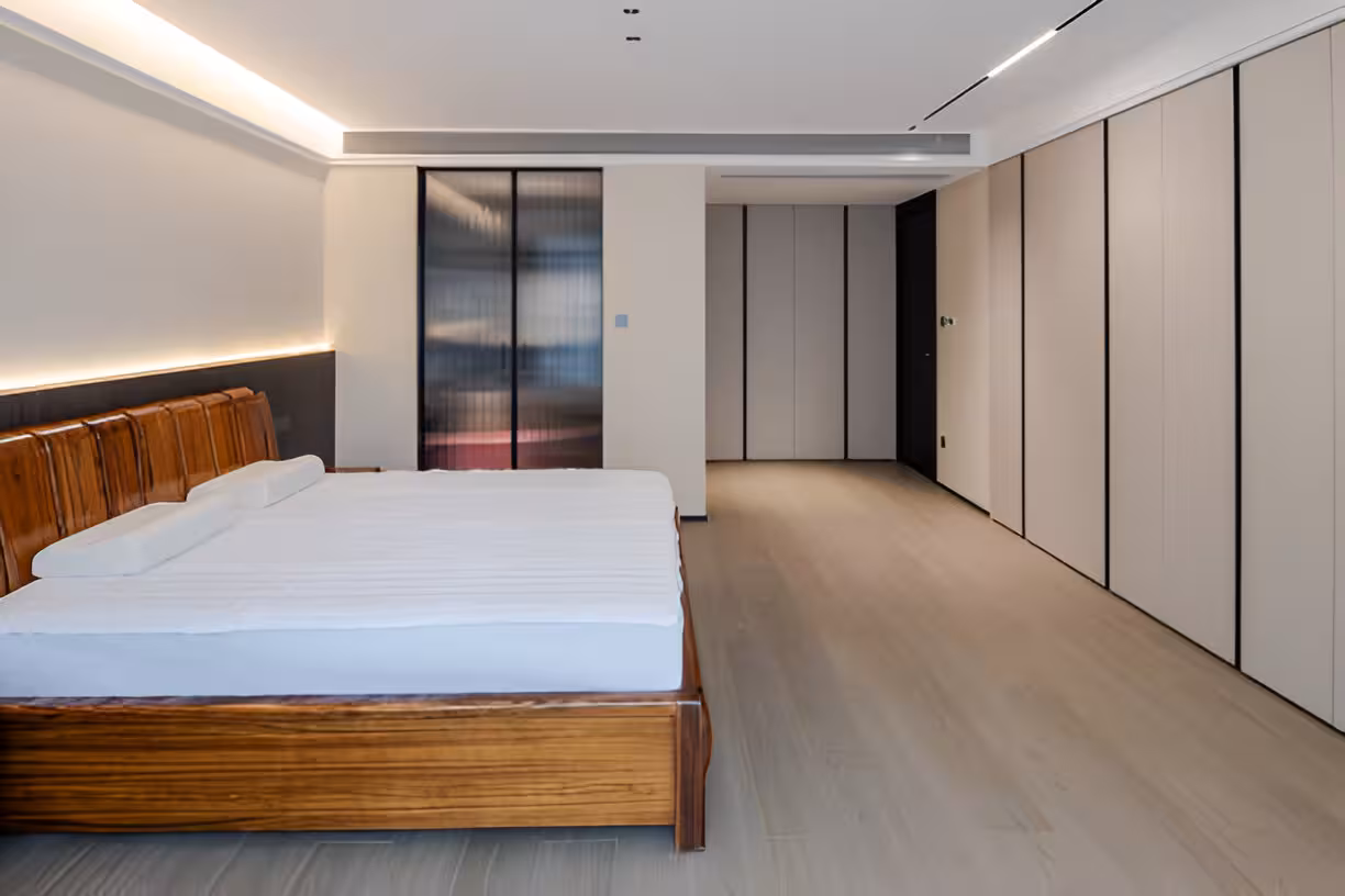 A bedroom showcasing a dimension with a california king size bed