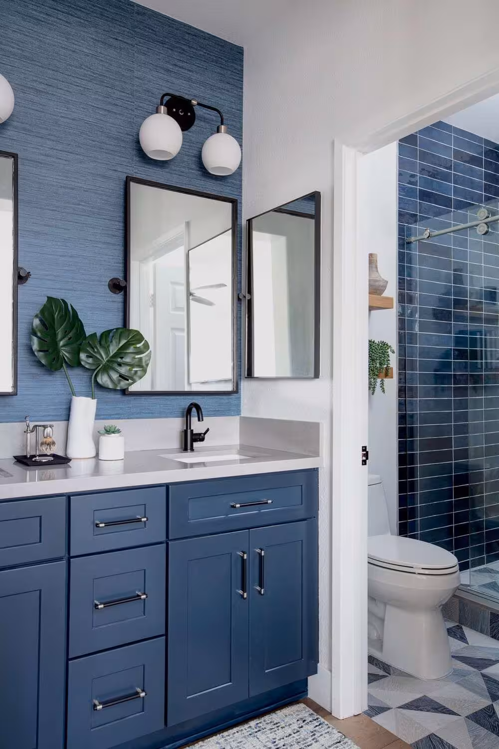 A blue bathroom vanity in a blue wall bathroom