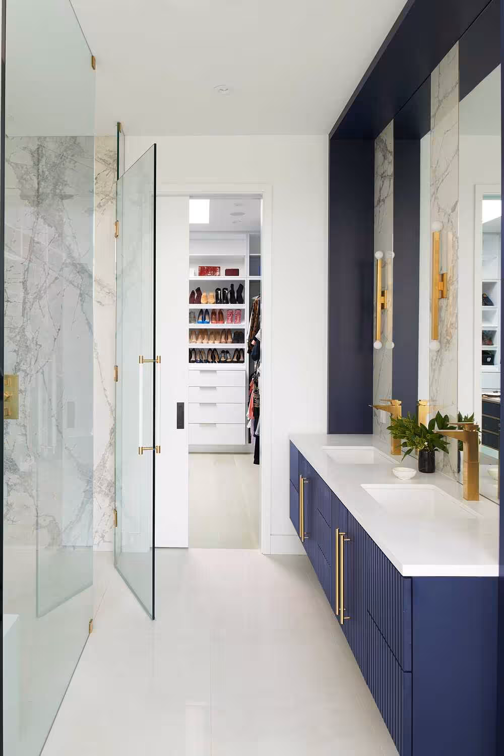 Navy blue bathroom vanity with framed design and double sink design with a white countertop