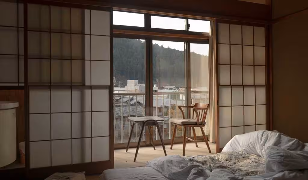 Brown wooden framed sliding door in a small bedroom apartment