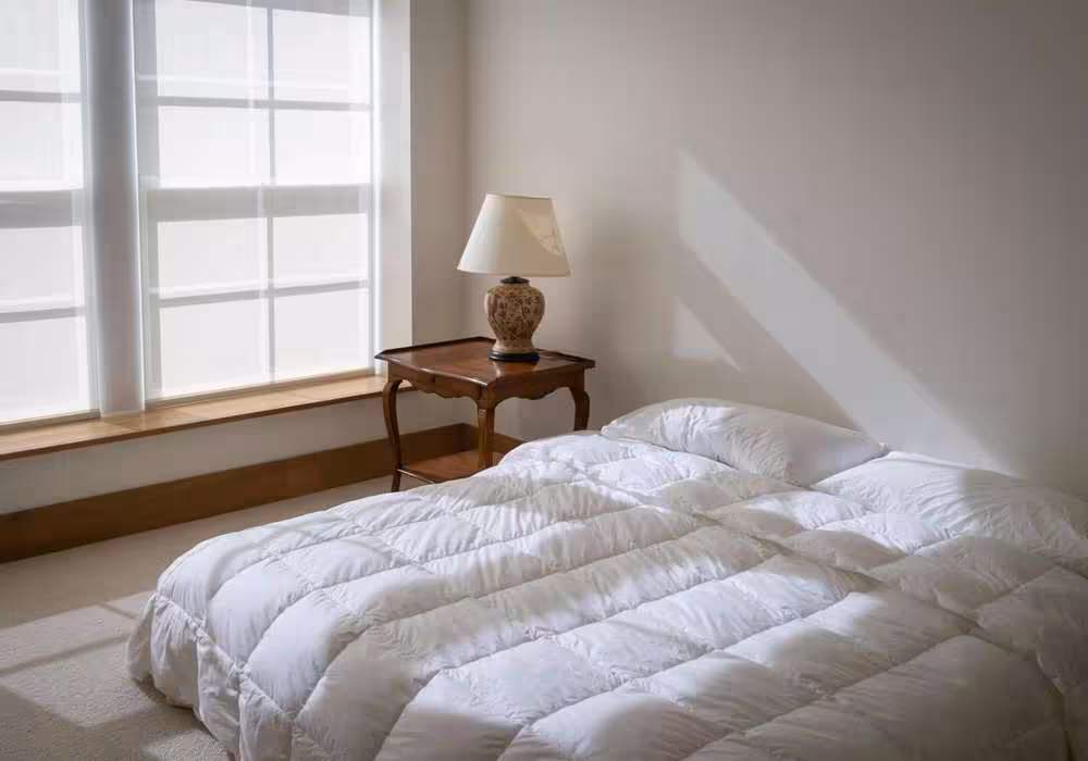 White king size comforter on a mattress