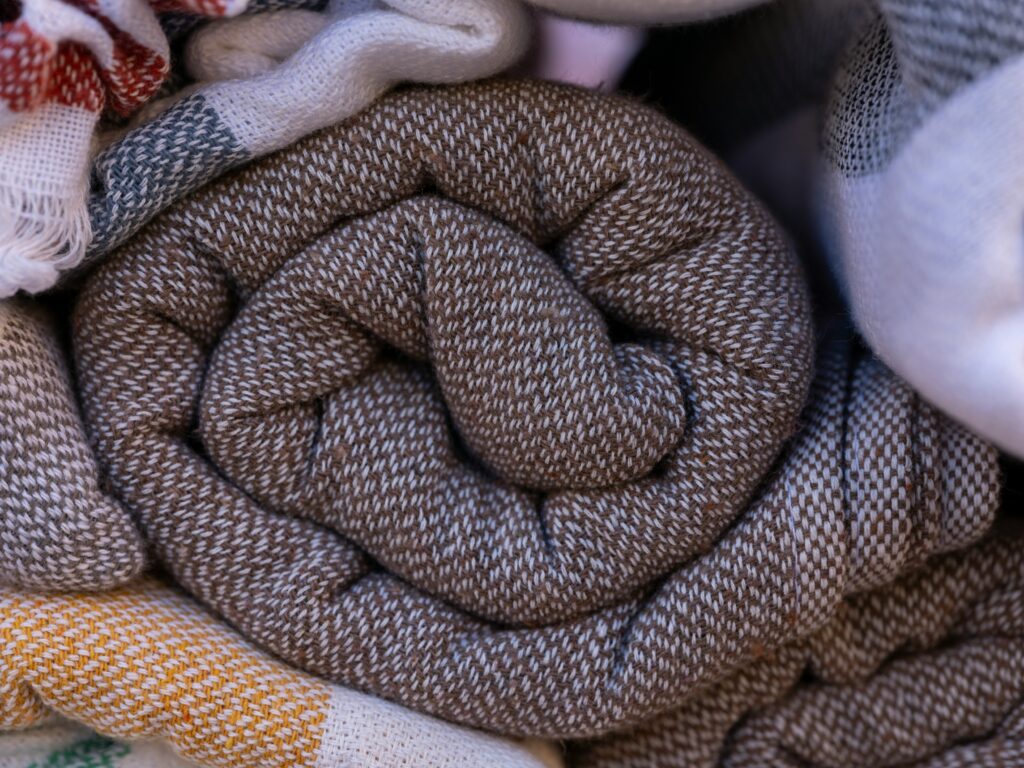 Colorful wool stacked for washing and caring